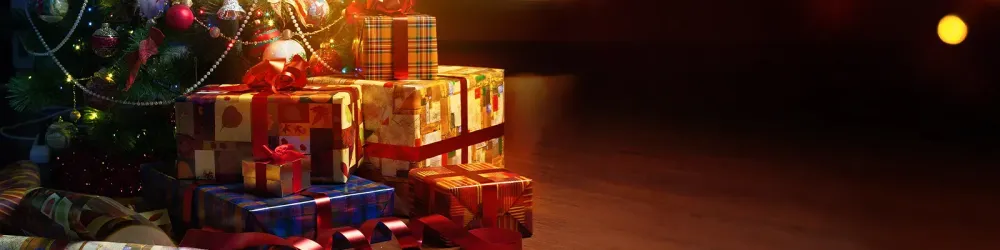 Christmas tree and holidays present on fireplace background
